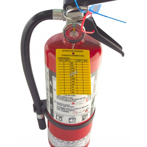 Yellow plastic monthly inspection tag for fire extinguishers, labelling in French, covering 4 years.
