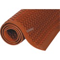 Red carpet 7/8 in, made of vulcanized rubber with cylindrical flow openings and rising grooves.