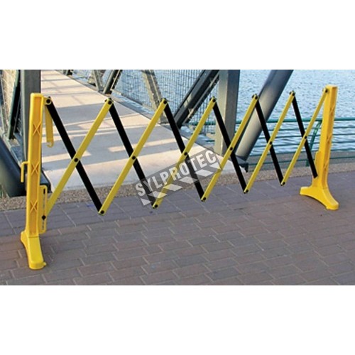 Barrière de sécurité extensible, 11 1/2 pieds (3,5 m), en polypropylène jaune et noir.